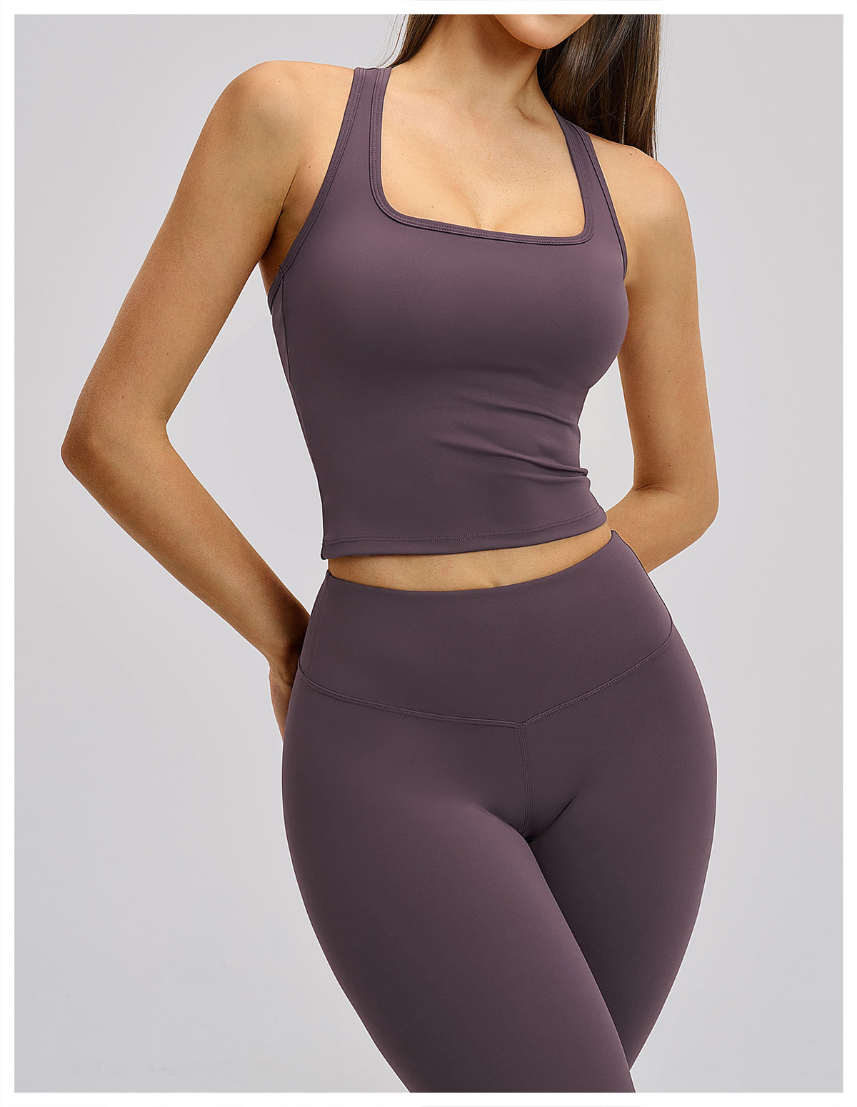 Dune Activewear Top in muted purple, angled front view showing fitted cropped silhouette